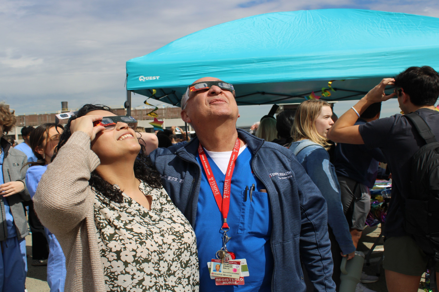 Nurses looking up at eclipse