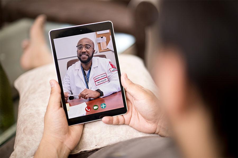 Dr. Neil King on a telemedicine appointment with patient