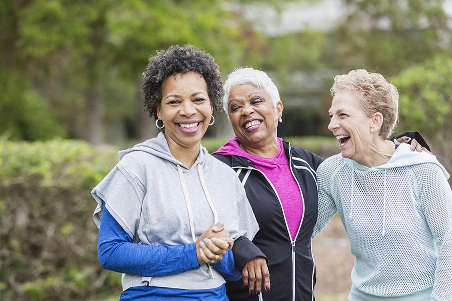 Women walking, laughing together