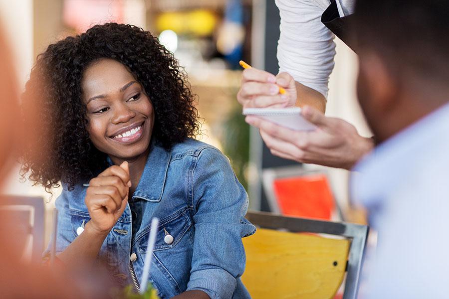 Woman ordering food at a restaurant